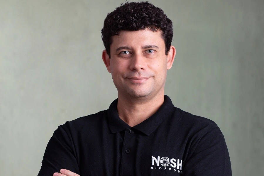 man in black tshirt smiling